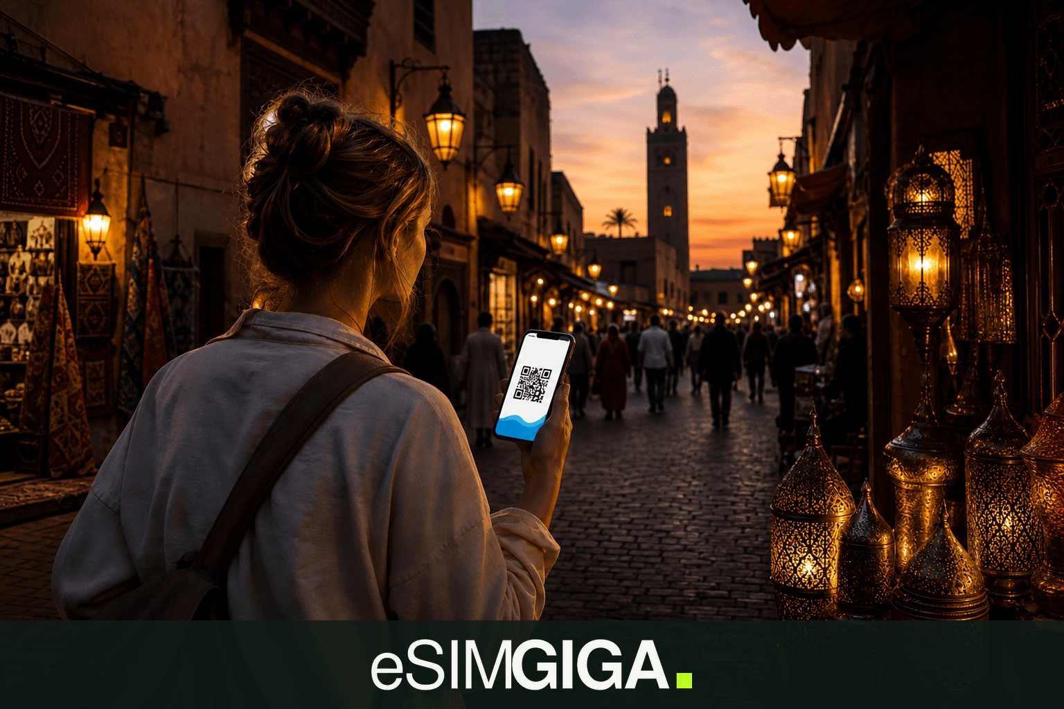 Traveller with an eSIM smartphone in a medina alley in Morocco, eSIM Giga banner