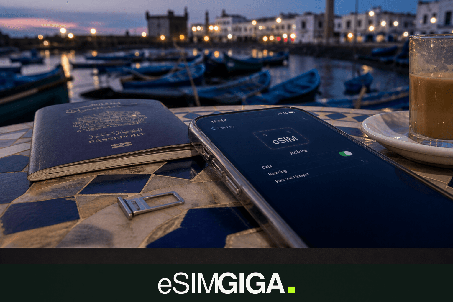 Plastic SIM card and eSIM smartphone on a café table in Essaouira, eSIM Giga banner