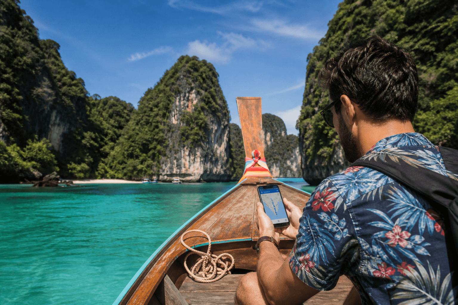 Traveller with eSIM smartphone on a long-tail boat in Thailand, eSIM Giga banner